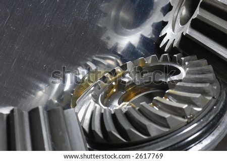 new gears with drops of oil reflecting in titanium, reality-look