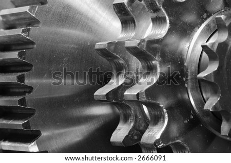 extreme close-up of three gears connecting