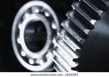 gears and lighting idea with bearing  ( blurred) against black velvet