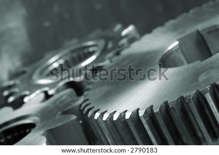 three gears connecting in a blue-metallic tone
