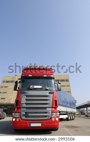 clean red truck stationery in commercial area
