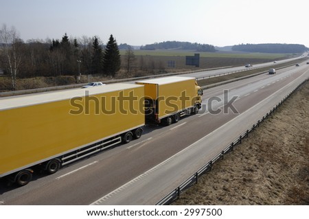 large yellow truck, lorry in early evening light