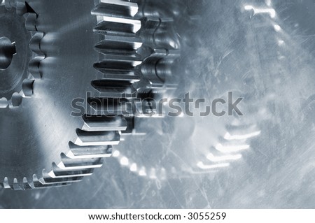 industrial gears abstract, reflection and in a metallic blue cast