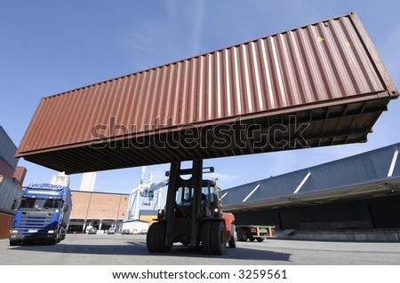 forklift and large container in extreme wide-angle perspective