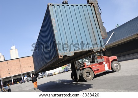 forklift truck moving container in a commercial-port