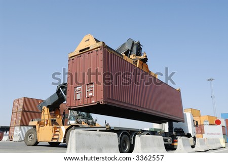forklift, container-truck lifting container from truck