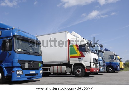 many trucks on line-up waiting for cargo loading, no trademarks