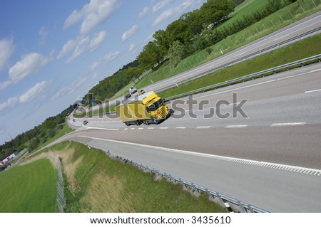 yellow truck in country-side highway, panoramic-view