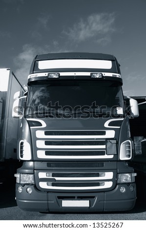 large truck, frontal view of cabin exterior, blue toned idea.