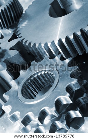 industrial gear parts in action, titanium based and in a bluish toning concept