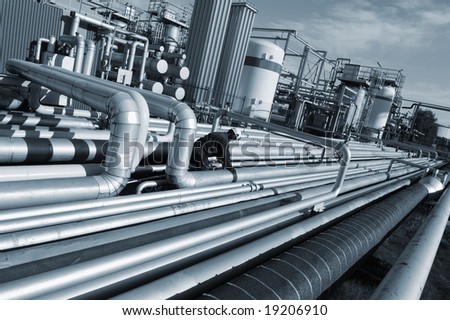 large pipelines construction as seen inside oil and gas industry, engineer at work, blue toning concept