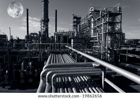moon-light over large oil and fuel refinery, dark toning concept in a surreal way.