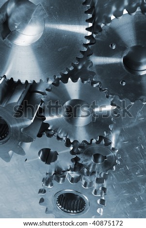 loarge gear and cog machinery, new titanium and steel parts. bluish toning