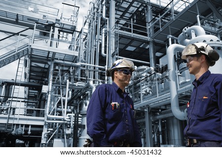 engineers working in chemical-plant, blue toned background