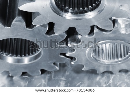 industrial gears against steel, angle from above