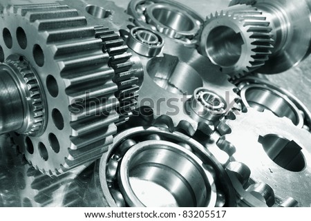 engineering parts arrangement blue toning concept focal-point on the large closest gear engineering parts arrangement blue toning concept focal-point on the large closest gear