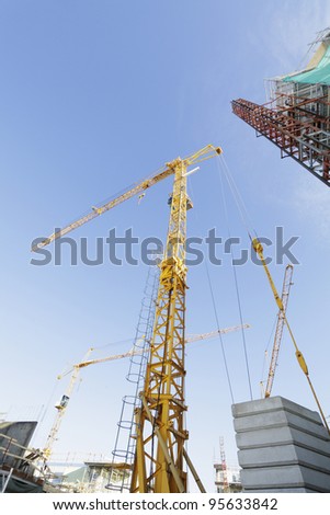 giant construction-cranes inside building site, early morning shot