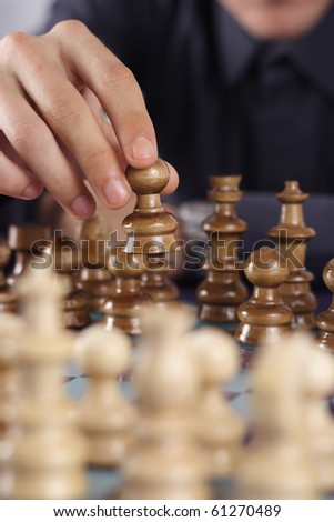 man playing chess - vertical