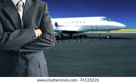 Businessman in front of private jet