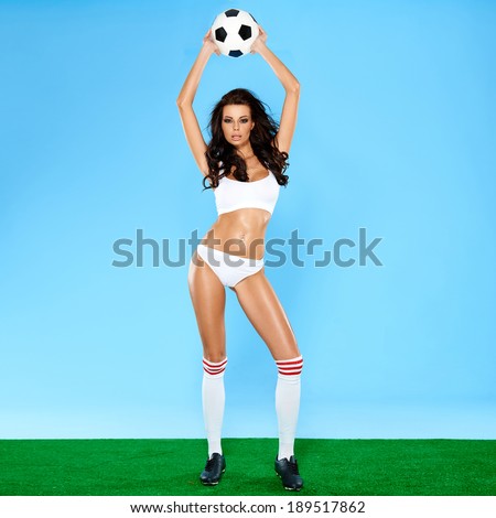 Beautiful busty brunette posing in erotic lingerie Stock Photo