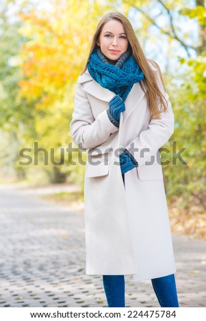 Woman Wearing Long Coat Standing Outside in Cool Autumn Termperature