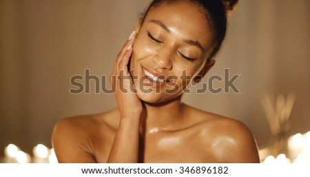 Skincare of young woman face with fresh flower slow motion