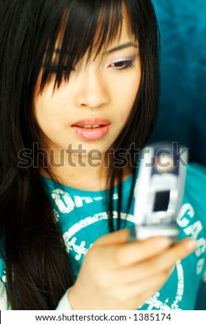 stock photo Sexy young asian girl holding cell phone