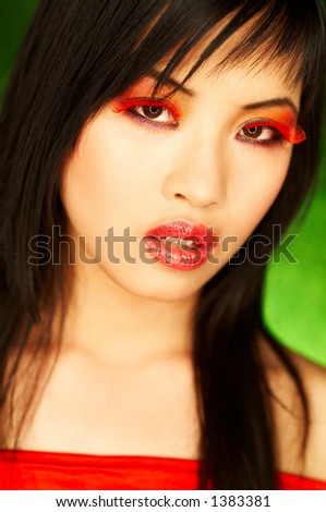 Portrait of attractive beautiful young sexy model with artificial eyelashes and impressive makeup