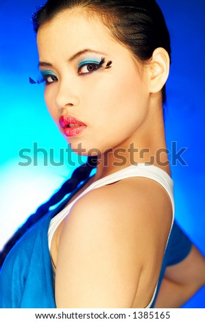 Portrait of attractive beautiful young sexy model with artificial eyelashes and impressive makeup