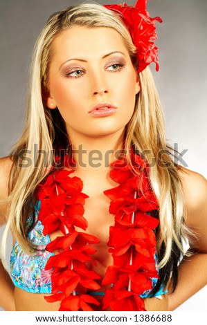 Sexy blond girl with red hawaii flowers