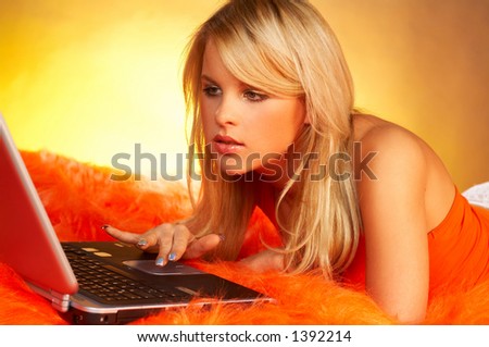 Sexy blond using laptop computer