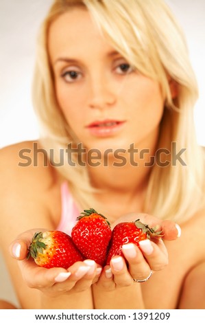 Young Blonde woman with fruits : Strawberry