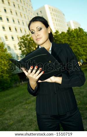 Business woman with black corporate folder