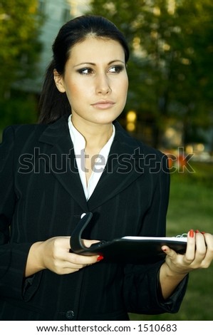 Business woman with black corporate folder