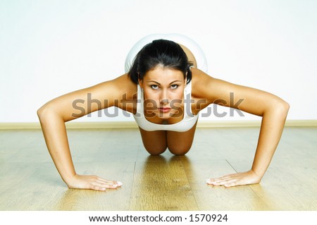Young beautiful woman during fitness time and exercising