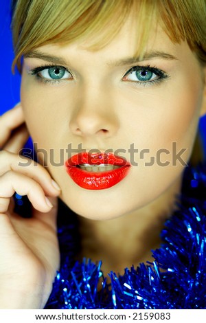 Portrait of Beautiful woman with red lipstick and color chain on her neck