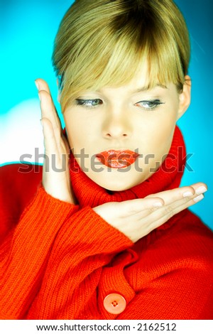 Portrait of beautiful woman wearing red sweater