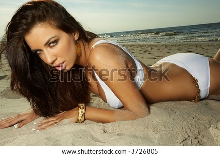 20-25 years old Beautiful Woman on the beach wearing bikini