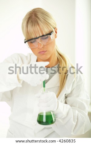 Female lab worker testing and experimenting