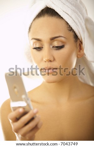 Portrait of Beautiful brunette woman using cell phone