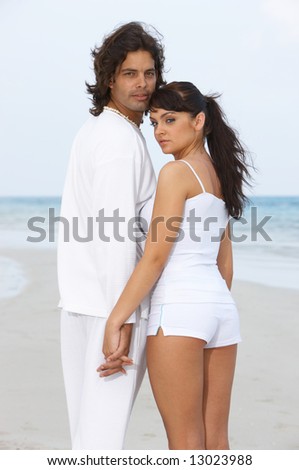 Romantic young couple spending time at the beach
