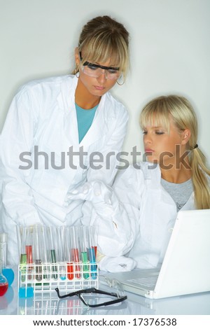 Female lab workers testing and experimenting