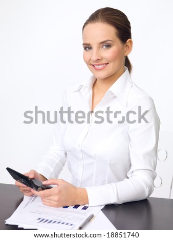 Portrait of beautiful and young business woman using cell phone