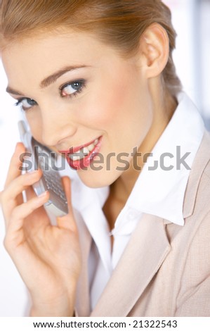 Beautiful business woman talking cell phone and smiling