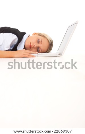 Very tired Businesswoman sleeping on her laptop while lying down on the floor