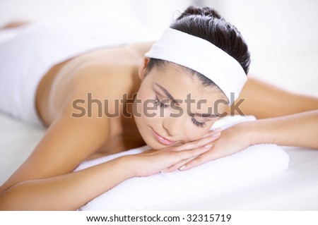 Young beautiful and relaxed taking spa treatment