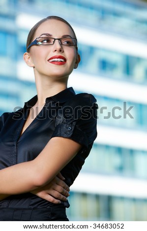 Beautiful business woman standing outdoor modern building