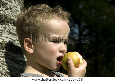 Kid going to take a bite off an apple
