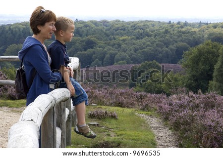 Grandma and grandson looking at a beautiful landscape.