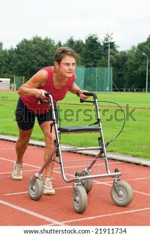 Disabled athlete at the starting line with her walker. Caricature picture to illustrate disability, ability, getting older, not wanna quit.